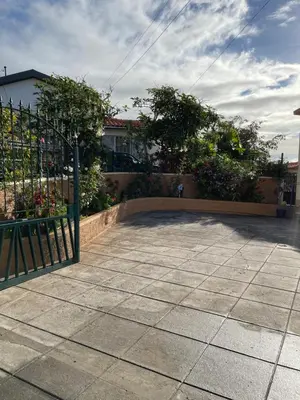 a gate to a yard with flowers and plants at Brooklyn&Fennel House in Funchal
