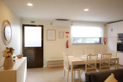 a kitchen and dining room with a table and chairs at Brooklyn&Fennel House in Funchal