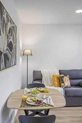 a living room with a table with food on it at Colinas by Homie in São Vicente