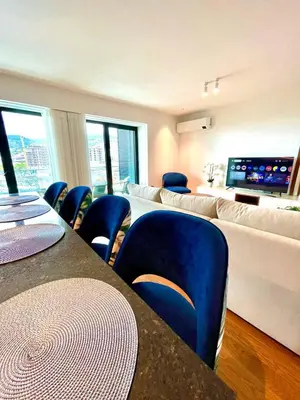 a balcony with couches and chairs on a building at LUX OCEAN VIEW Apartment Varino 05 in Funchal