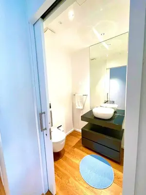 a room with a microwave and a chair and a fan at LUX OCEAN VIEW Apartment Varino 05 in Funchal