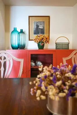 a dining room with a table and two blue vases at Renovated Traditional House w 3BR & Outdoor Space in Funchal