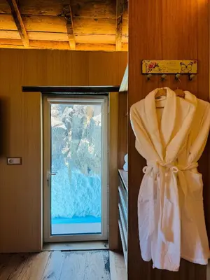 a window in a room with a curtain and a door at Villas Calhau da Lapa 10 in Campanário