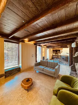 a living room with a couch and a table at Villas Calhau da Lapa 10 in Campanário