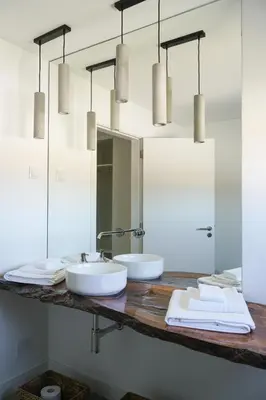 a bathroom with two sinks and a mirror at Casa Barranco in Carrapateira