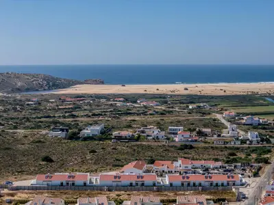 an aerial view of a beach and houses at Casa Barranco in Carrapateira