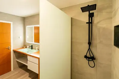 a bathroom with a shower and a sink at Casa Antonette, Lovely house with a pool in Calheta