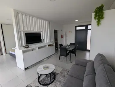 a living room with a couch and a tv at Apartment Antonette in Calheta