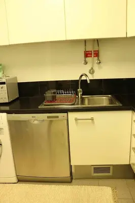 a kitchen with a sink and a counter top at GuestReady - Rodamar Apartment in Funchal