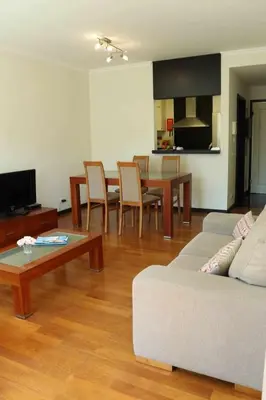 a living room with a couch and a table at GuestReady - Rodamar Apartment in Funchal
