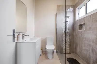 a bathroom with a shower and a toilet and a sink at A ver o mar rooms - Santa Cruz city center in Santa Cruz