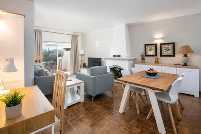 a living room with a table and a dining room at Seascape - Escape to the seaside in Luz