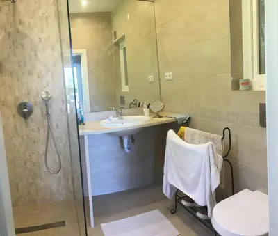 a bathroom with a shower and a sink and a toilet at 3 Bedroom villa with a sea view completely private in Alagoas