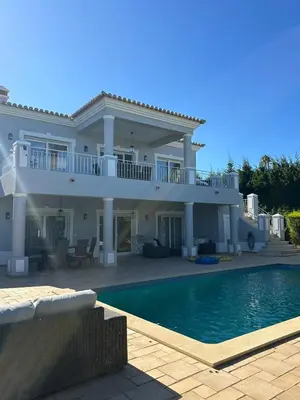 a large house with a swimming pool in front of it at 3 Bedroom villa with a sea view completely private in Alagoas