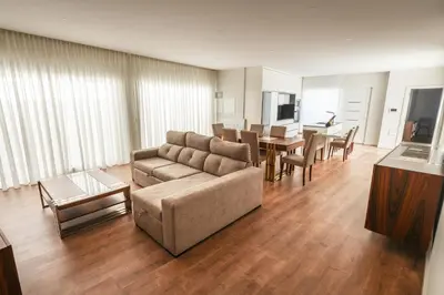 a living room with a couch and a table at Casa do Beco do Barlavento in Vila Baleira
