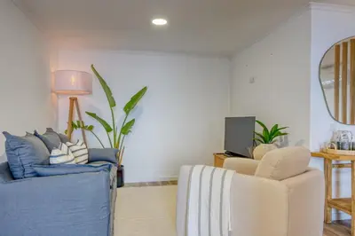 a living room with two chairs and a tv at Vale dos Amores, a Home in Madeira in Calheta