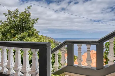 a balcony with a view of the ocean at Vale dos Amores, a Home in Madeira in Calheta
