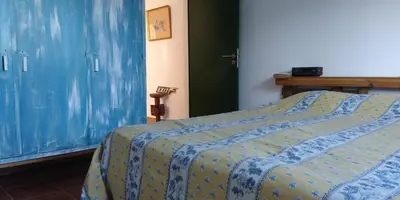 a bedroom with a bed with a blue cover at Casa da Oliveira - Nice 2 bedrooms Bungalow in Lagos in Lagos