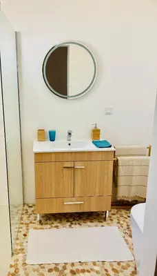a bathroom with a sink and a mirror on the wall at Casa Pompilio in Sagres