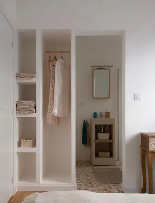 a white room with a closet with a mirror at Casa Pompilio in Sagres