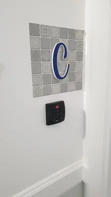 a refrigerator with a google sign on the door at RC Fltas Funchal C in Funchal