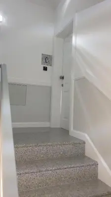 a stairway with a white door and a stair case at RC Fltas Funchal C in Funchal