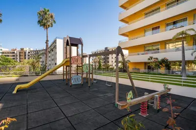a playground on the roof of a building at Green Park by An Island Apart in Funchal