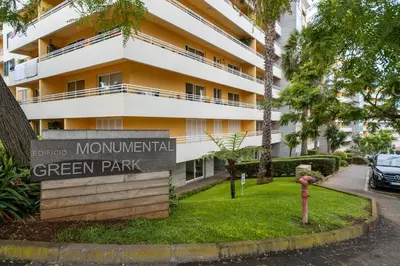 a sign for a green park in front of a building at Green Park by An Island Apart in Funchal