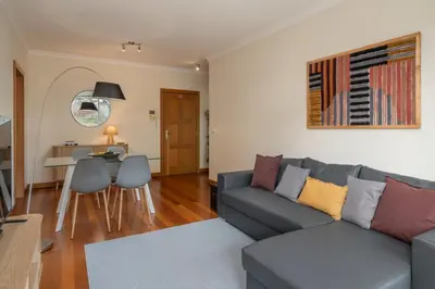 a living room with a couch and a table at Green Park by An Island Apart in Funchal