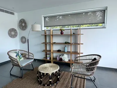 a living room with two chairs and a table at Luz Vila in Luz