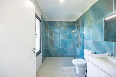 a bathroom with a toilet and a sink at Paradise Pereira House BY YOUR KEY MADEIRA in Calheta
