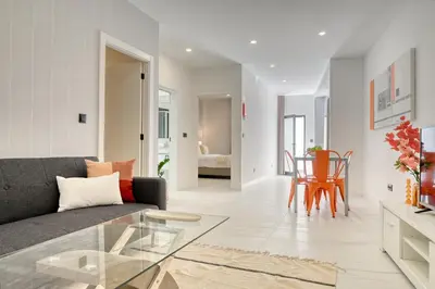 a living room with a couch and a table at Beco Santa Emilia 1C, a Home in Madeira in Funchal