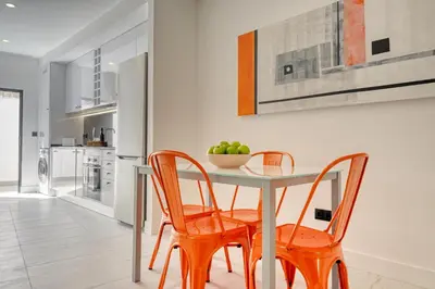 a dining room with a table and two chairs at Beco Santa Emilia 1C, a Home in Madeira in Funchal