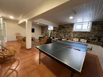 a ping pong table in the middle of a room at Lazareto 148 Hostel in Funchal