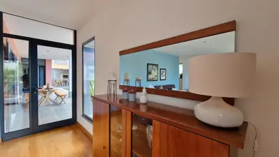 a room with a mirror and a table with a lamp at Mon Rêve Portugais by LovelyStay in Funchal