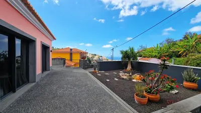 a balcony of a house with potted plants at Mon Rêve Portugais by LovelyStay in Funchal