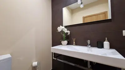 a bathroom with a white sink and a mirror at Mon Rêve Portugais by LovelyStay in Funchal