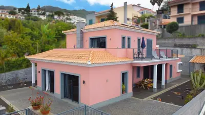 a pink house with a balcony on top of it at Mon Rêve Portugais by LovelyStay in Funchal