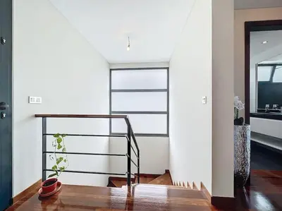 a staircase in a house with a potted plant at Villa Ribeiro Real 12 A in Câmara de Lobos