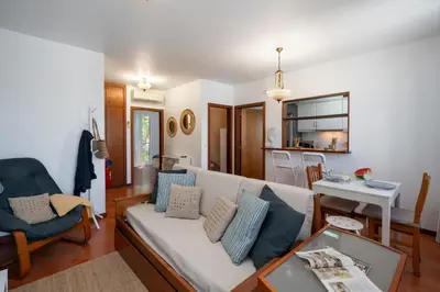 a living room with a couch and a table at Apartamento Ilha Dourada by An Island Apart in Porto Santo