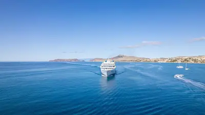 a boat in the middle of the water at Apartamento Ilha Dourada by An Island Apart in Porto Santo