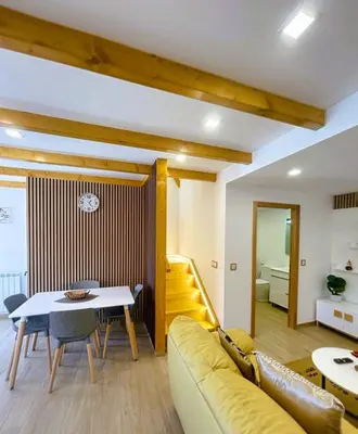 a living room with a couch and a table at Celeiro do Avô in Santana