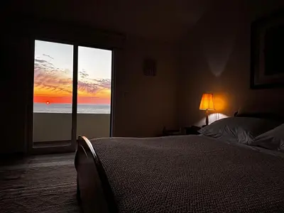 a bedroom with a bed and a view of the ocean at Bela Vigia in Jardim do Mar