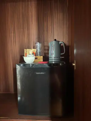 a coffee maker sitting on top of a refrigerator at Bela Vigia in Jardim do Mar