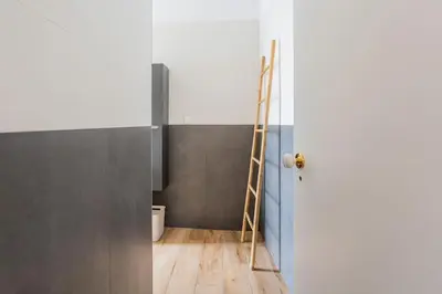 a ladder sitting in a room next to a door at Cantinho do Barreiro - Calheta in Calheta