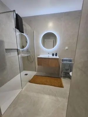 a bathroom with a sink and a mirror at Blue Diamond-seaview & free park in Funchal