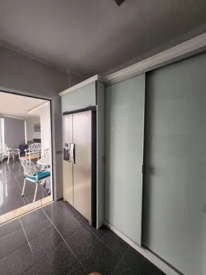 a room with a hallway with a chair and a table at Blue Diamond-seaview & free park in Funchal