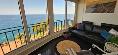 a living room with a couch and a view of the ocean at Blue Diamond-seaview & free park in Funchal