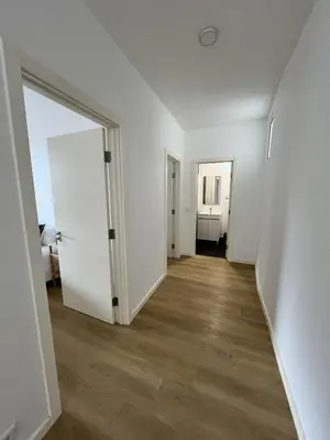 an empty room with white walls and wooden floors at Ribeira Roots Residence in Santa Cruz