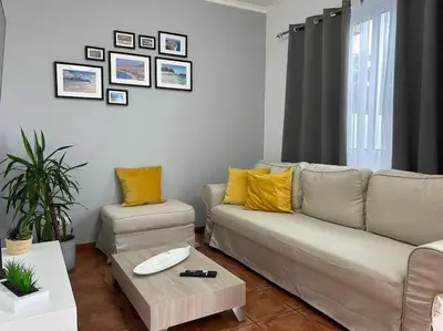 a living room with a couch and a coffee table at Golden Island in Porto Santo
